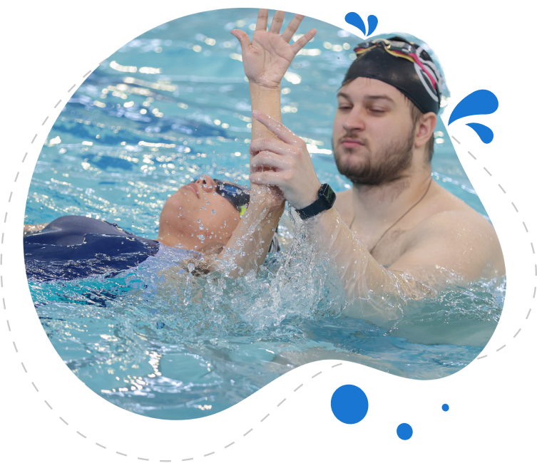 A Splash Fit instructor supporting a swimmer on their back